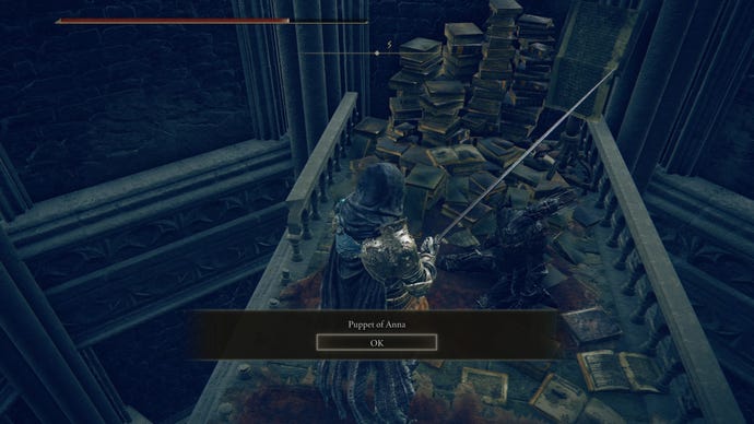 The player in Elden Ring: Shadow Of The Erdtree inspects a Puppet of Anna on a walkway inside a tower.